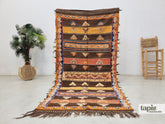 Latia - Tapis berbère 128x251 marron et orange - Tapis Taznakht à symboles vintage